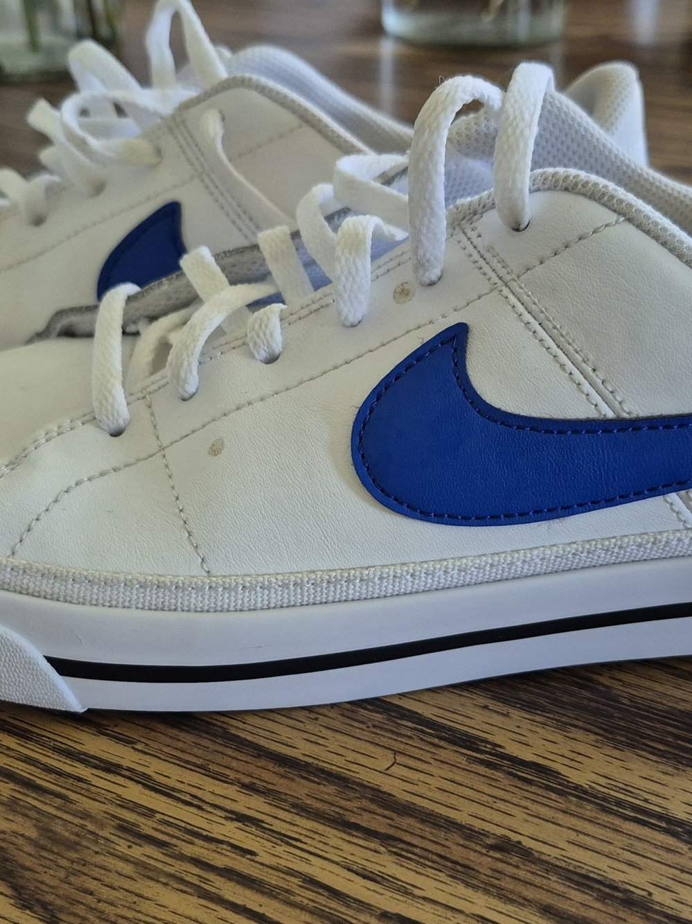 Nike White Sneakers with Blue Swoosh